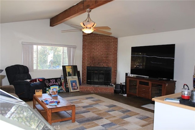 living room featuring a brick fireplace, ceiling fan, and vaulted ceiling with beams