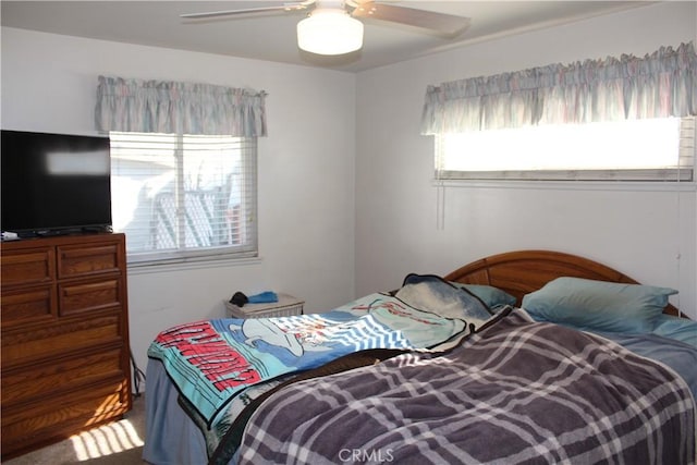 bedroom featuring ceiling fan