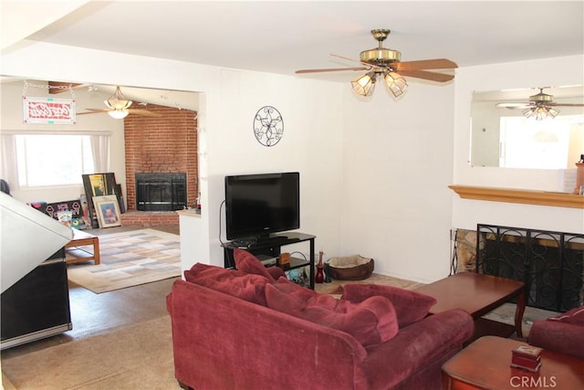 living room featuring ceiling fan and a fireplace