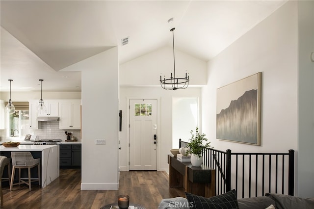 388 Primrose Cir, Lake Arrowhead, CA 92352 - foyer entrance featuring visible vents, dark wood-style floors, vaulted ceiling, and plenty of natural light