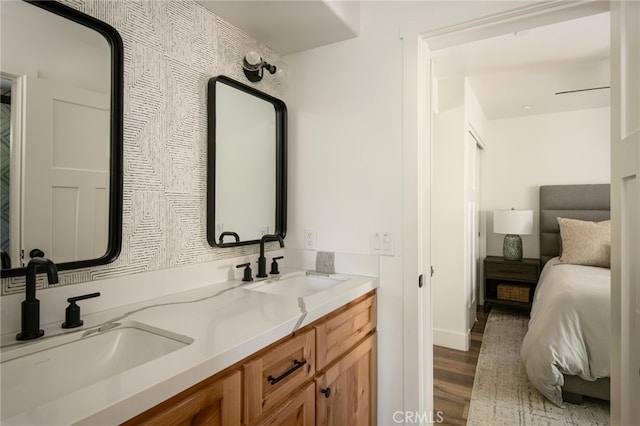 388 Primrose Cir, Lake Arrowhead, CA 92352 - ensuite bathroom with connected bathroom, double vanity, a sink, and wood finished floors
