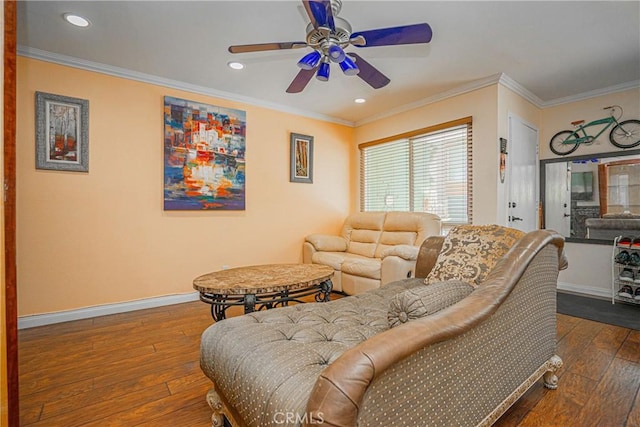 living room with baseboards, a ceiling fan, crown molding, and dark wood-style floors