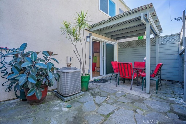 view of patio featuring central air condition unit and outdoor dining space