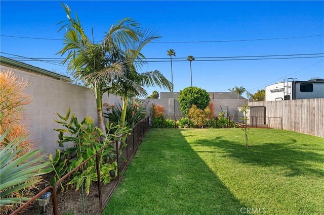 view of yard with a fenced backyard