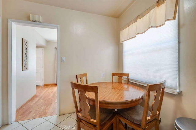 dining area featuring light tile patterned floors