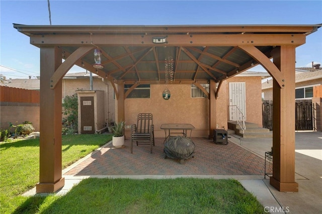 view of patio / terrace featuring a gazebo and fence