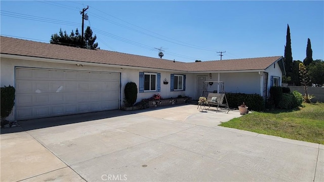 single story home with fence, an attached garage, driveway, and stucco siding