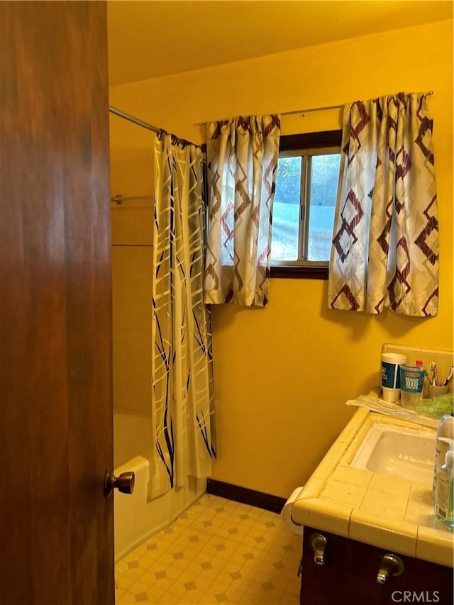 4644 La Canada Rd, Fallbrook, CA 92028 - bathroom featuring tile patterned floors, shower / bath combo with shower curtain, vanity, and baseboards