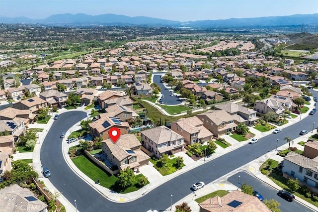 birds eye view of property with a mountain view and a residential view