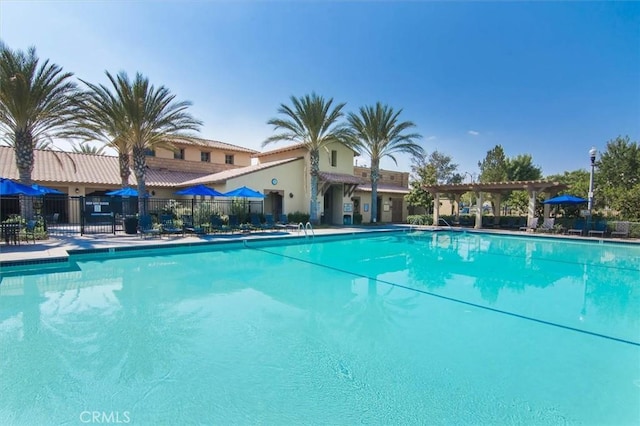 community pool featuring fence