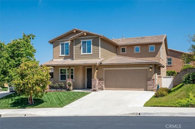 craftsman-style home featuring stone siding, stucco siding, a porch, a front yard, and concrete driveway