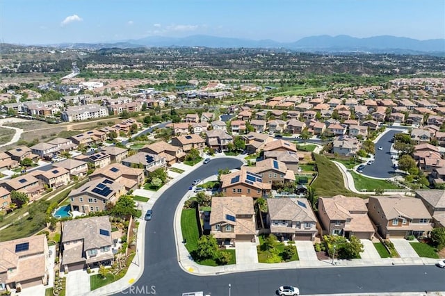 birds eye view of property with a residential view and a mountain view