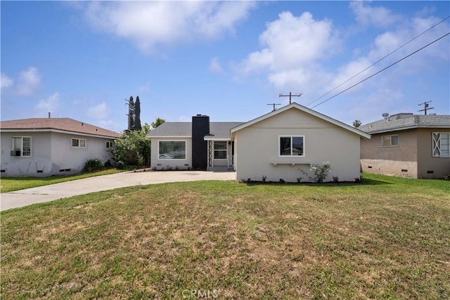 1233 Oakhurst Dr, San Bernardino, CA 92404 - single story home featuring a front lawn, a chimney, and driveway
