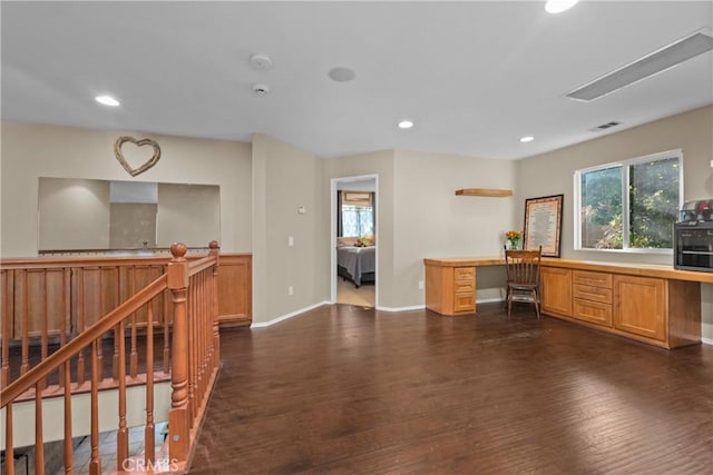 46140 Grace Ct, Temecula, CA 92592 - home office with built in study area, dark wood-type flooring, plenty of natural light, recessed lighting, and baseboards