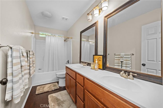 46140 Grace Ct, Temecula, CA 92592 - full bathroom featuring wood finished floors, double vanity, shower / bath combo, and toilet
