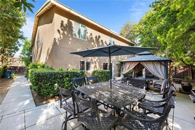 46140 Grace Ct, Temecula, CA 92592 - view of patio featuring a gazebo, fence, and outdoor dining space