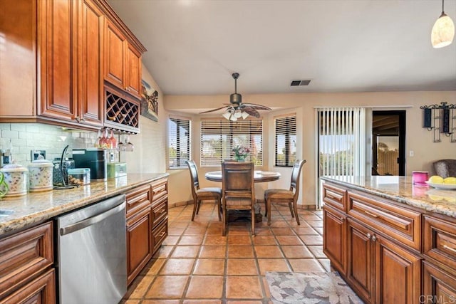 1315 Hermana Ct, Vista, CA 92084 - kitchen with stainless steel dishwasher, backsplash, ceiling fan, brown cabinetry, and baseboards