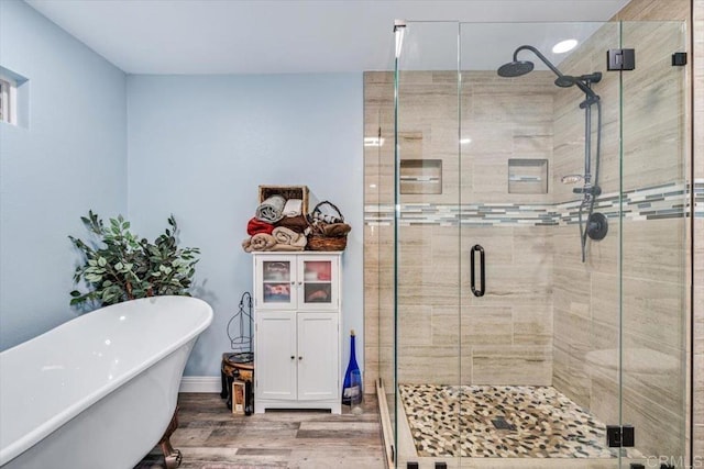1315 Hermana Ct, Vista, CA 92084 - bathroom with wood finished floors, a freestanding bath, and a shower stall