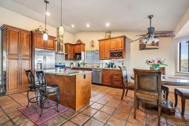 1315 Hermana Ct, Vista, CA 92084 - kitchen featuring appliances with stainless steel finishes, wall chimney range hood, backsplash, a center island, and recessed lighting