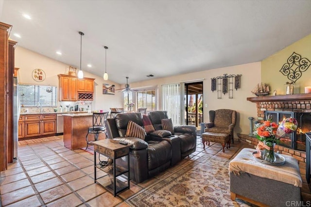 1315 Hermana Ct, Vista, CA 92084 - living room with plenty of natural light, a ceiling fan, lofted ceiling, a fireplace, and recessed lighting