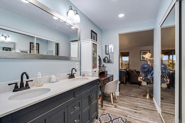 1315 Hermana Ct, Vista, CA 92084 - ensuite bathroom with wood finished floors, recessed lighting, and double vanity