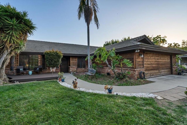 1315 Hermana Ct, Vista, CA 92084 - ranch-style house featuring a garage, a front lawn, driveway, and brick siding