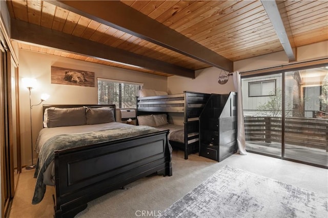 bedroom featuring carpet flooring, beamed ceiling, and wood ceiling