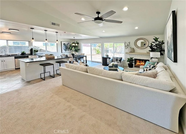 living area featuring visible vents, recessed lighting, and a healthy amount of sunlight