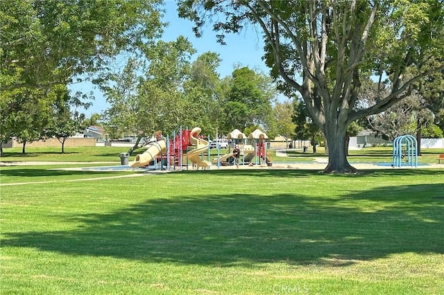 view of community featuring a yard and playground community