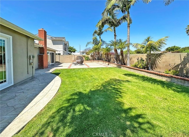 view of yard featuring a fenced backyard and a patio area