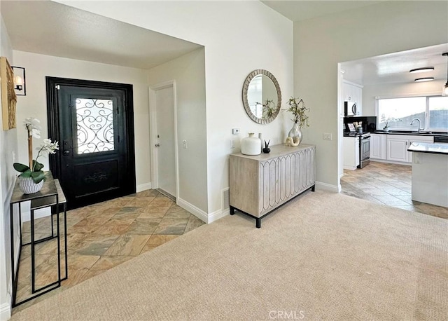 entryway featuring baseboards