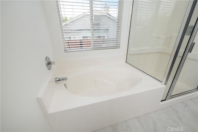 full bath with a garden tub and a shower stall