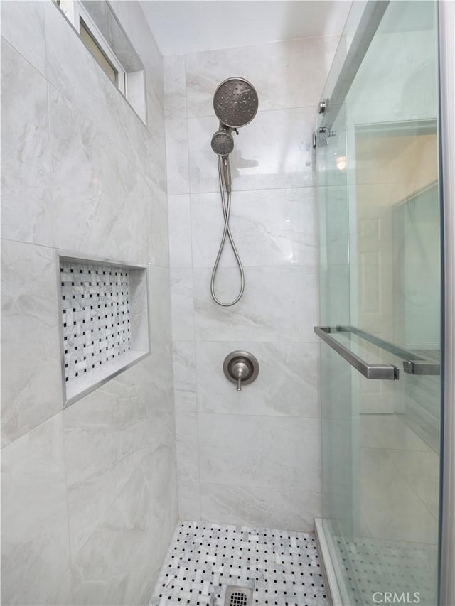 full bath with a shower stall