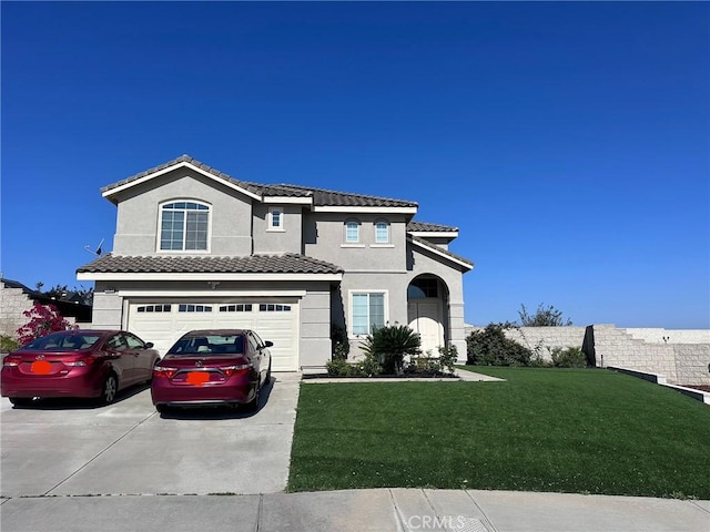 traditional-style house featuring driveway, a garage, stucco siding, and a front yard