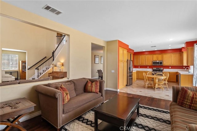 8309 Clover Creek Rd, Riverside, CA 92508 - living room with light wood-type flooring, stairway, baseboards, and recessed lighting