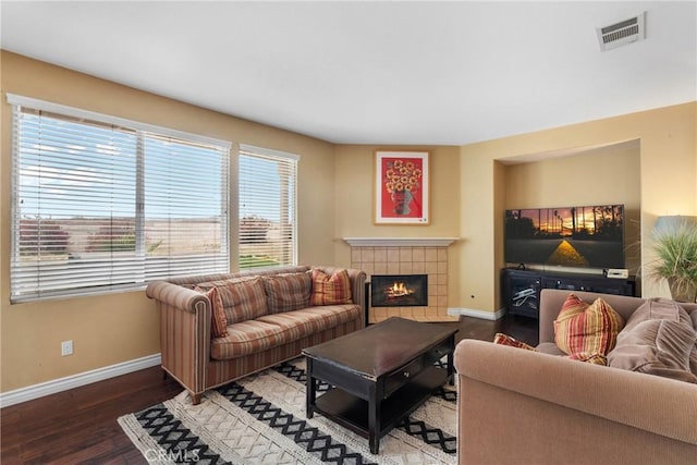 8309 Clover Creek Rd, Riverside, CA 92508 - living area with baseboards, a tile fireplace, and wood finished floors