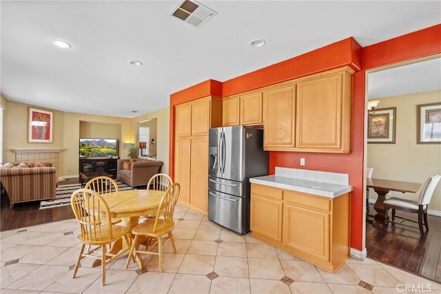 8309 Clover Creek Rd, Riverside, CA 92508 - kitchen featuring stainless steel fridge with ice dispenser, tile countertops, plenty of natural light, open floor plan, and recessed lighting