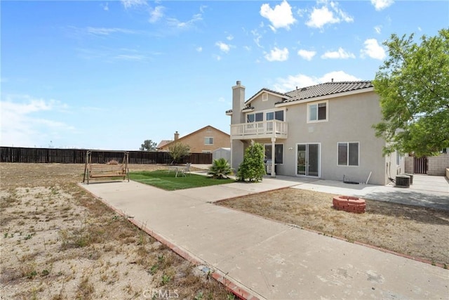 8309 Clover Creek Rd, Riverside, CA 92508 - back of house featuring a patio, a balcony, a fire pit, stucco siding, and a tiled roof