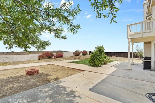 8309 Clover Creek Rd, Riverside, CA 92508 - fenced backyard featuring a patio area, area for grilling, and a balcony