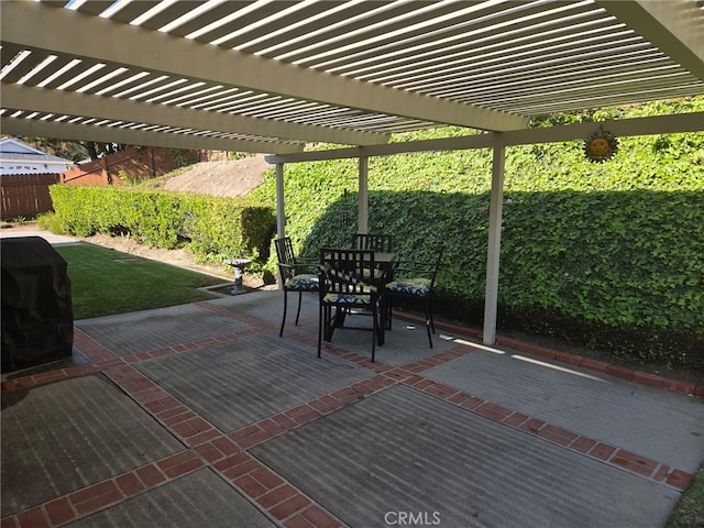 view of patio / terrace featuring area for grilling, a pergola, a fenced backyard, and outdoor dining space