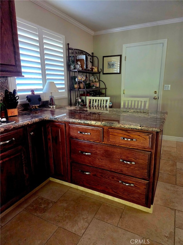 kitchen with ornamental molding and stone countertops