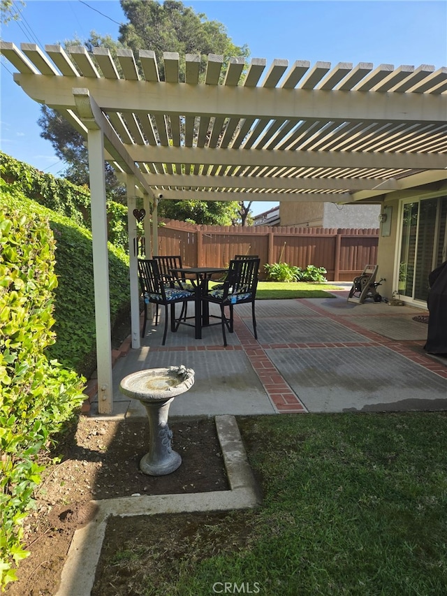 view of patio featuring a fenced backyard, a pergola, and area for grilling