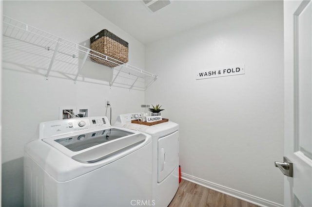 29101 Long Horn Ln, Winchester, CA 92596 - laundry room featuring baseboards, laundry area, independent washer and dryer, and wood finished floors