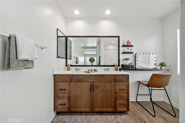 29101 Long Horn Ln, Winchester, CA 92596 - bathroom with double vanity, baseboards, a sink, and wood finished floors
