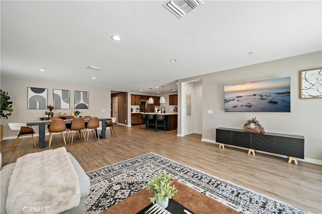 29101 Long Horn Ln, Winchester, CA 92596 - living area featuring baseboards, recessed lighting, light wood-style flooring, and visible vents