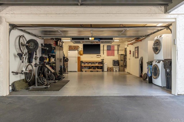 garage with stacked washer and dryer