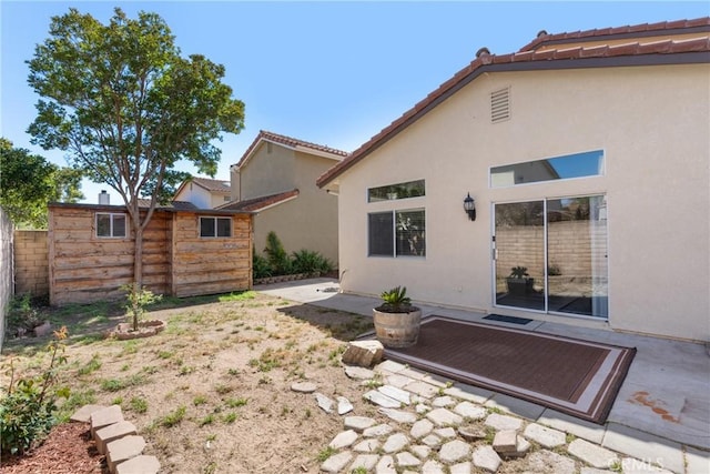 1128 Grass Valley Way, Santa Maria, CA 93454 - rear view of house featuring a patio, fence, an outdoor structure, and stucco siding