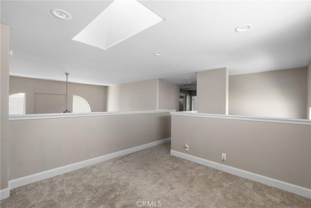 1128 Grass Valley Way, Santa Maria, CA 93454 - spare room with baseboards, recessed lighting, carpet, and a skylight