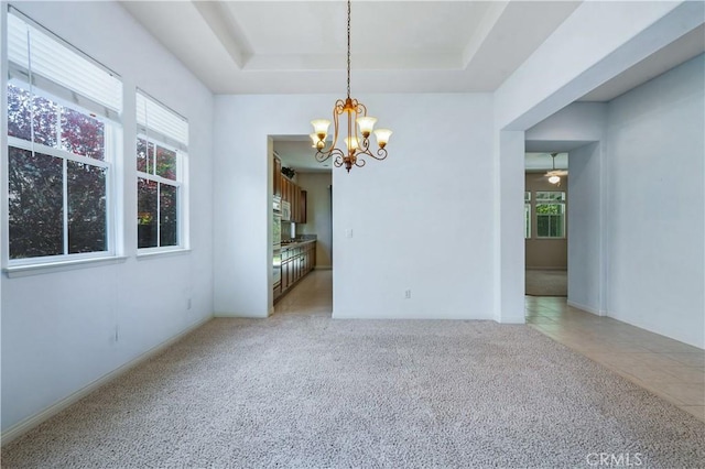 2612 Silverwood Way, Paso Robles, CA 93446 - unfurnished dining area featuring a chandelier, light colored carpet, and a tray ceiling
