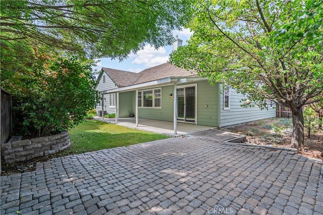 2612 Silverwood Way, Paso Robles, CA 93446 - rear view of property with a patio, a lawn, and a chimney